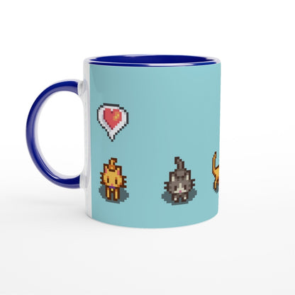 A white mug with a blue handle and rim displays pixelated graphics of Ginger and Tabby cats and a heart emote from Stardew Valley.
