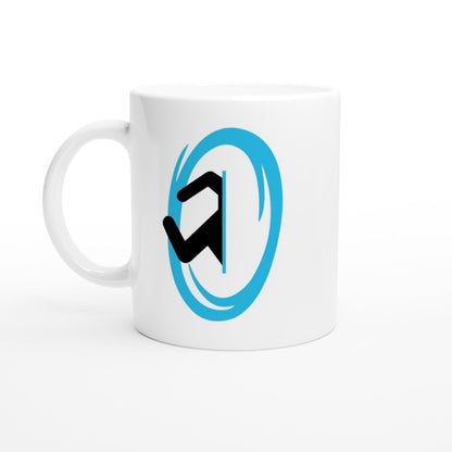 A white ceramic mug displays a blue Portal design from the Half-Life video game.