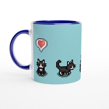 A ceramic mug features pixelated graphics of tuxedo cats and a heart emote from the Stardew Valley computer game.