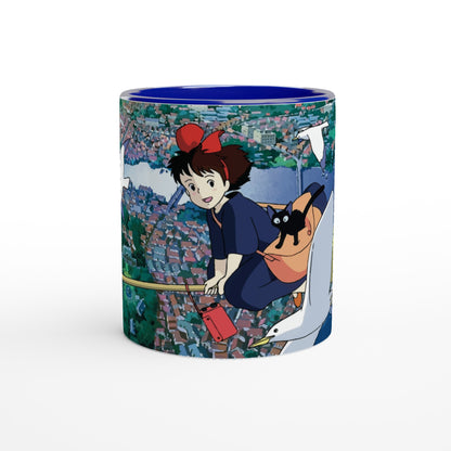 The mug depicts Kiki from Kiki's Delivery Service flying over Koriko on Gigi, a white seagull, as inspired by Studio Ghibli.