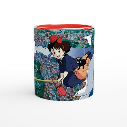 The mug depicts Kiki from Kiki's Delivery Service flying over Koriko on Gigi, a white seagull, with a red bag and cityscape background inspired by Studio Ghibli.