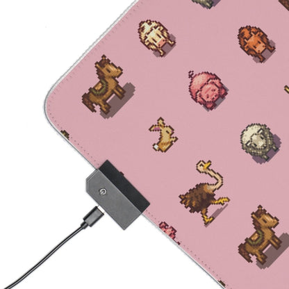 A pink desk mat featuring pixel art animals from Stardew Valley is plugged into a USB port.