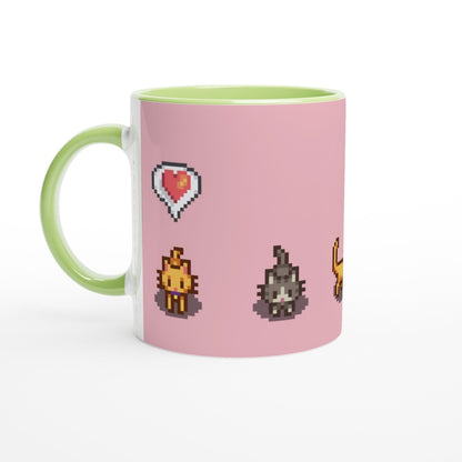 A pink mug with a green handle features pixel art of Ginger and Tabby cats and emotes from Stardew Valley.