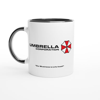 A white mug features the Umbrella Corporation logo from Resident Evil along with the phrase "Our Business is Life Itself".