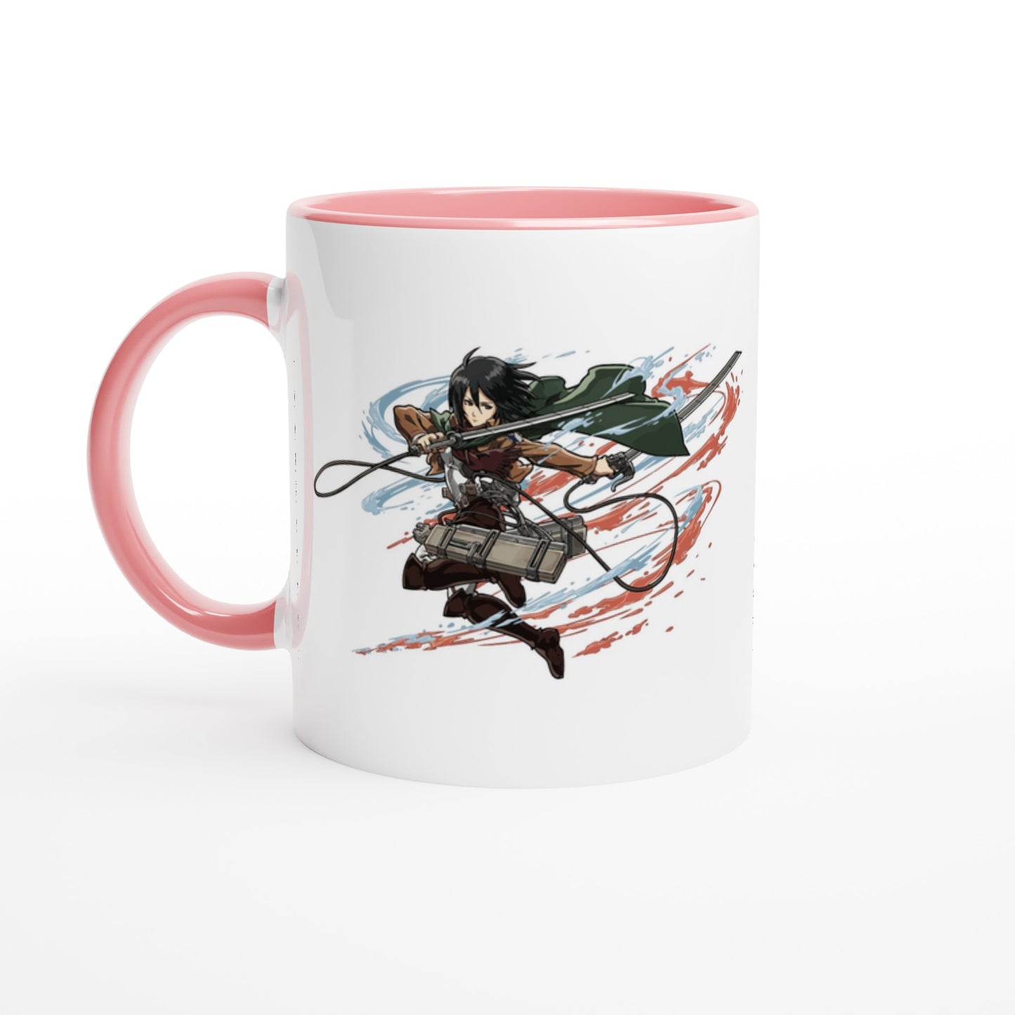 A white ceramic mug depicts Mikasa Ackerman from the Attack on Titan anime series in action, wielding her blades against a backdrop of red and blue streaks.