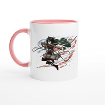 A white ceramic mug depicts Mikasa Ackerman from the Attack on Titan anime series in action, wielding her blades against a backdrop of red and blue streaks.