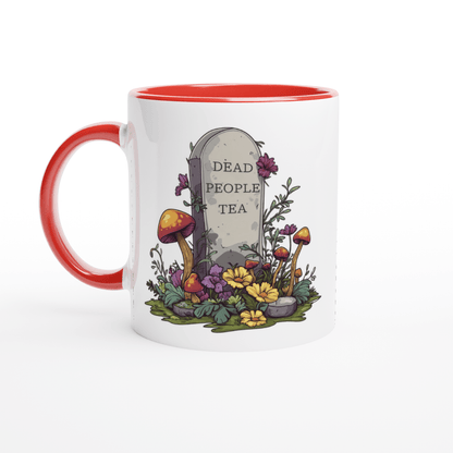 A white ceramic mug with a red interior and handle features an illustration of a tombstone surrounded by flowers and mushrooms that reads "Dead People Tea.