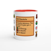 A white mug with a red rim features a Stardew Drinks pattern including pixelated sprites and a card describing hot chocolate's effects.
