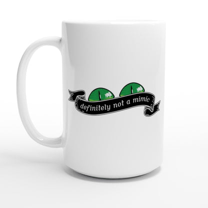 A white mug displays a green D&D mimic illustration with the text "definitely not a mimic" on a banner.