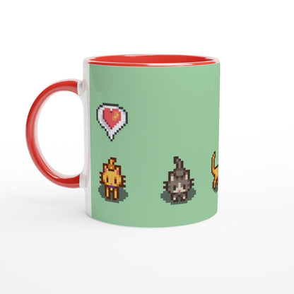A white mug with a red rim displays pixelated graphics from Stardew Valley featuring ginger and tabby cats alongside emotes.