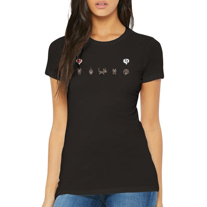 A woman wears a black fitted t-shirt featuring grey cats and emotes from the Stardew Valley computer game.