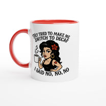 A white coffee mug with a red interior and handle features an illustration of Amy Winehouse holding a cup while text reads "They tried to make me switch to decaf, I said no, no, no.