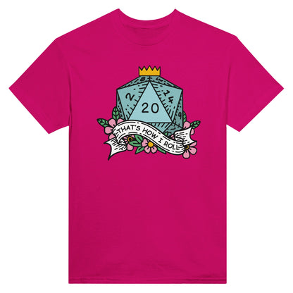A pink t-shirt displays a D20 die graphic with floral accents and the phrase "That's How I Roll" referencing Dungeons & Dragons.