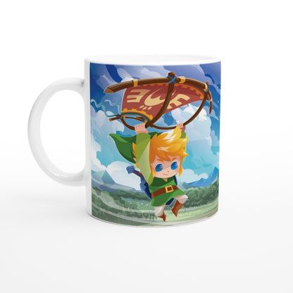 A white mug displays a cute chibi Link from The Legend of Zelda soaring through a Hyrule landscape using a paraglider.