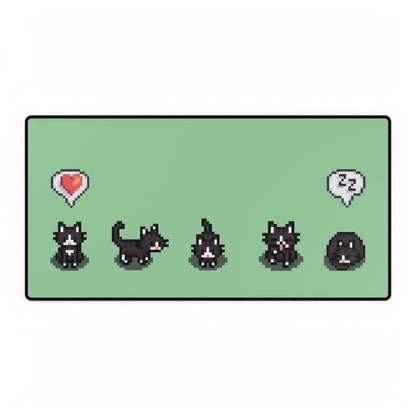 An extra large desk mat features a black and white pixel art pattern of tuxedo cats from Stardew Valley in various poses.
