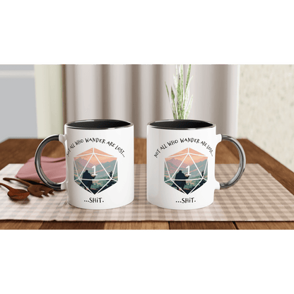 Two D&D mugs feature a mountain landscape graphic alongside a d20 die displaying a "1" and the phrase "...shit.