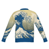 Back view of a Great Wave knit cardigan featuring a Japanese art inspired design of blue and white ocean waves on a cream background.