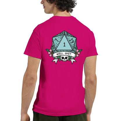 A pink t-shirt displays a D&D critical fail graphic of a twenty-sided die labeled "1" surrounded by floral elements and the words "Well, Sh*t.