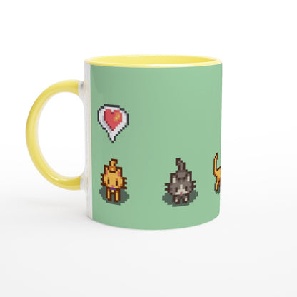 A white mug with a yellow handle and rim features pixelated graphics from Stardew Valley including Ginger and Tabby cats and heart and lightning emotes.