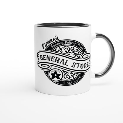 A white ceramic mug displays a black logo for Pierre's General Store from Stardew Valley, featuring ornate lettering and the words "Serving Pelican Town.