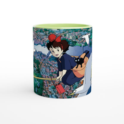 The Kiki's Delivery Service mug depicts Kiki flying over Koriko on Gigi, a white seagull, while carrying a red parcel.