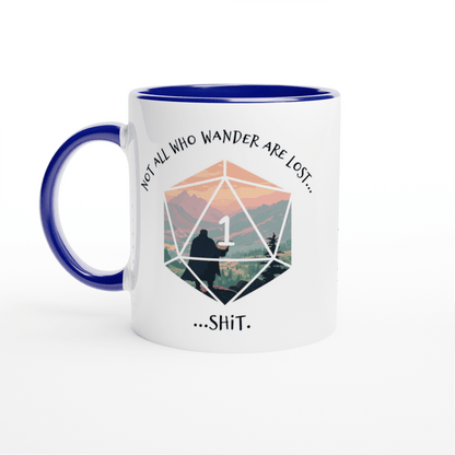 A white ceramic D&D mug features a blue rim and handle, displaying a D20 die graphic with a mountain landscape inside and the words "Not all who wander are lost...SHIT.