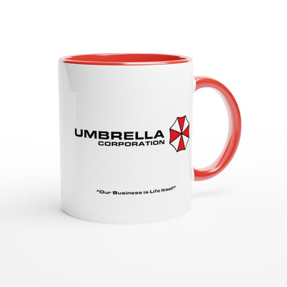 A white mug features the Umbrella Corporation logo and tagline "Our Business is Life Itself" referencing the Resident Evil franchise.