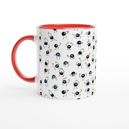 A white mug with a red handle and rim features a repeating pattern of black Susuwatari, also known as dust sprites from Spirited Away.