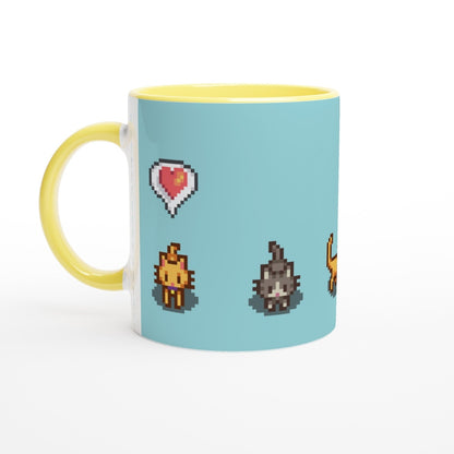 A white mug with a yellow handle and rim features pixel art of ginger and tabby cats alongside heart and emote icons from Stardew Valley.