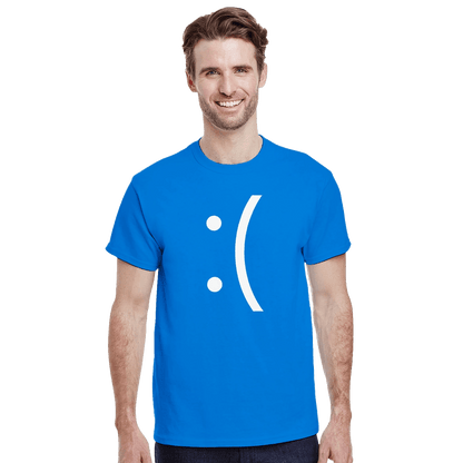 A man wearing a blue Gildan® 5000 unisex crewneck t-shirt displays a white emoticon graphic on the front.