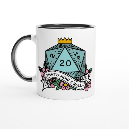 A white mug features a graphic of a D&D d20 die with the phrase "That's How I Roll" displayed on a floral banner below it.