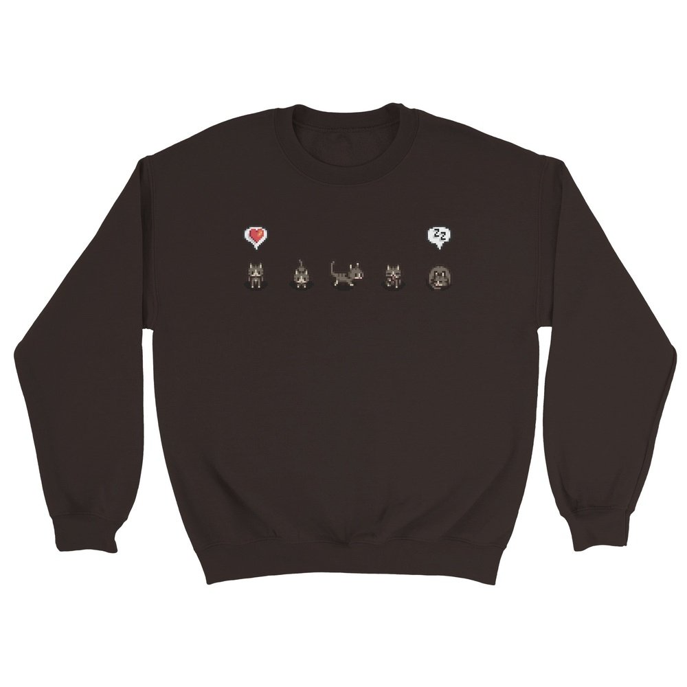 A grey unisex crewneck sweatshirt displays a graphic featuring characters and emotes from the Stardew Valley computer game.