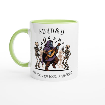 A white mug with a green handle features an illustration of a D&D bard playing music for dancing skeletons and the words "ADHD & D" and "Roll For... Oh Look, A Squirrel!