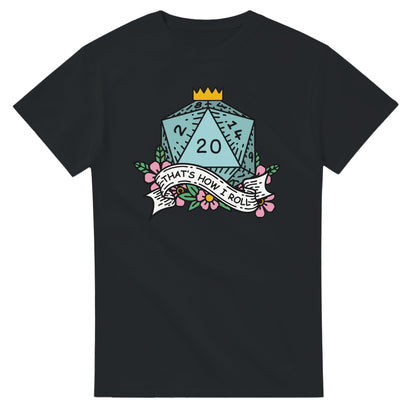 A black t-shirt displays a D20 die adorned with flowers and a banner reading "That's How I Roll," referencing Dungeons & Dragons gameplay.