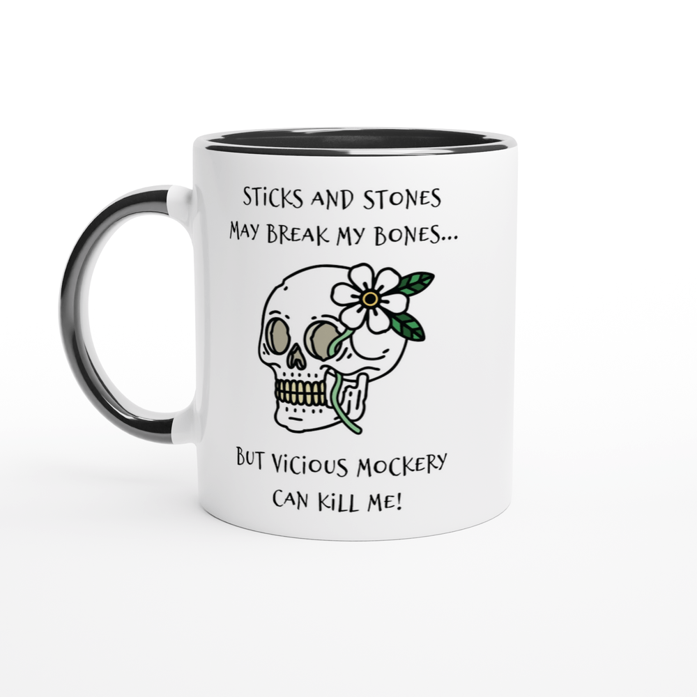 A white mug with a black rim and handle features a skull illustration adorned with a flower and text referencing "Sticks and Stones" and "Vicious Mockery" from Dungeons and Dragons.