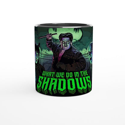This mug features a stylized illustration of Guillermo and other characters from What We Do In The Shadows, including Laszlo, Nadja, Nandor, and Colin Robinson.