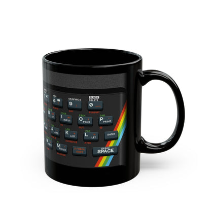 A black mug displays pixel art graphics resembling a Retro Spectrum keyboard layout.