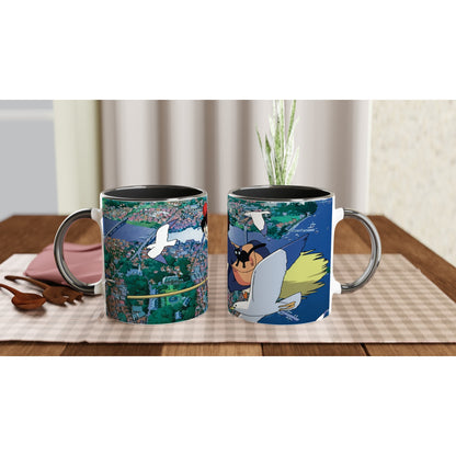 A ceramic mug depicts Kiki flying over Koriko with Gigi, inspired by Studio Ghibli's Kiki's Delivery Service.