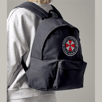 Person wearing a black backpack with Umbrella Corporation logo on a neutral background