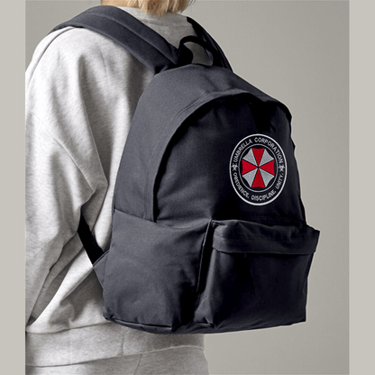 Person wearing a black backpack with Umbrella Corporation logo on a neutral background