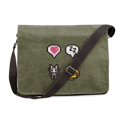 A green Stardew Cats messenger bag features embroidered icons and emotes including a heart, number two, a pixelated cat, and a fishing rod.
