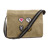 A tan Stardew Cats messenger bag features embroidered icons and emotes including a heart, speech bubble, cat, and pixelated character.