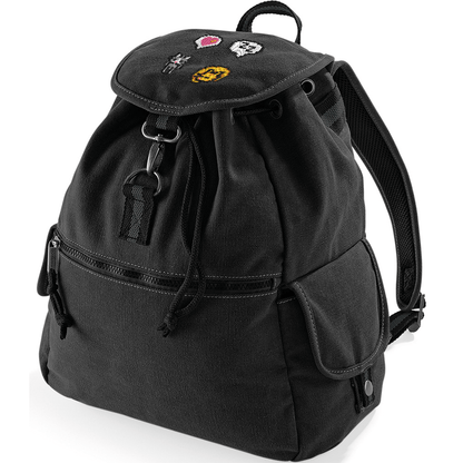 A black canvas backpack features embroidered images of cats and a heart emote, referencing the video game Stardew Valley.
