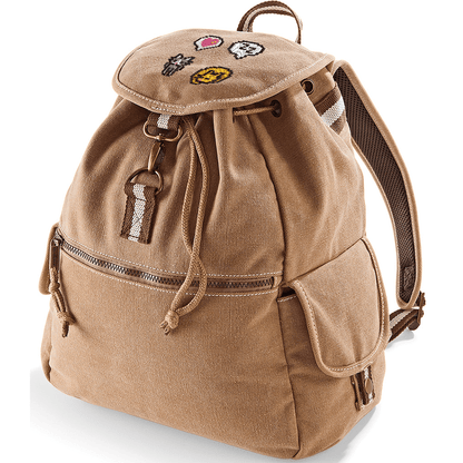 A brown canvas bag resembling a Stardew Valley backpack features embroidered icons including cats and a heart emote on its top flap.