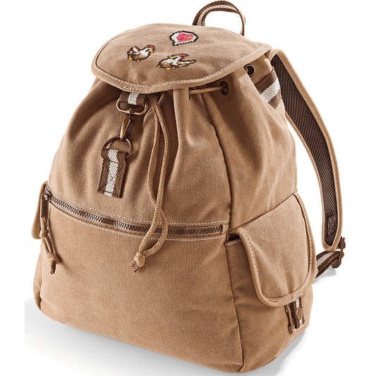 A tan canvas backpack features embroidered chickens and a heart emote design inspired by Stardew Valley.