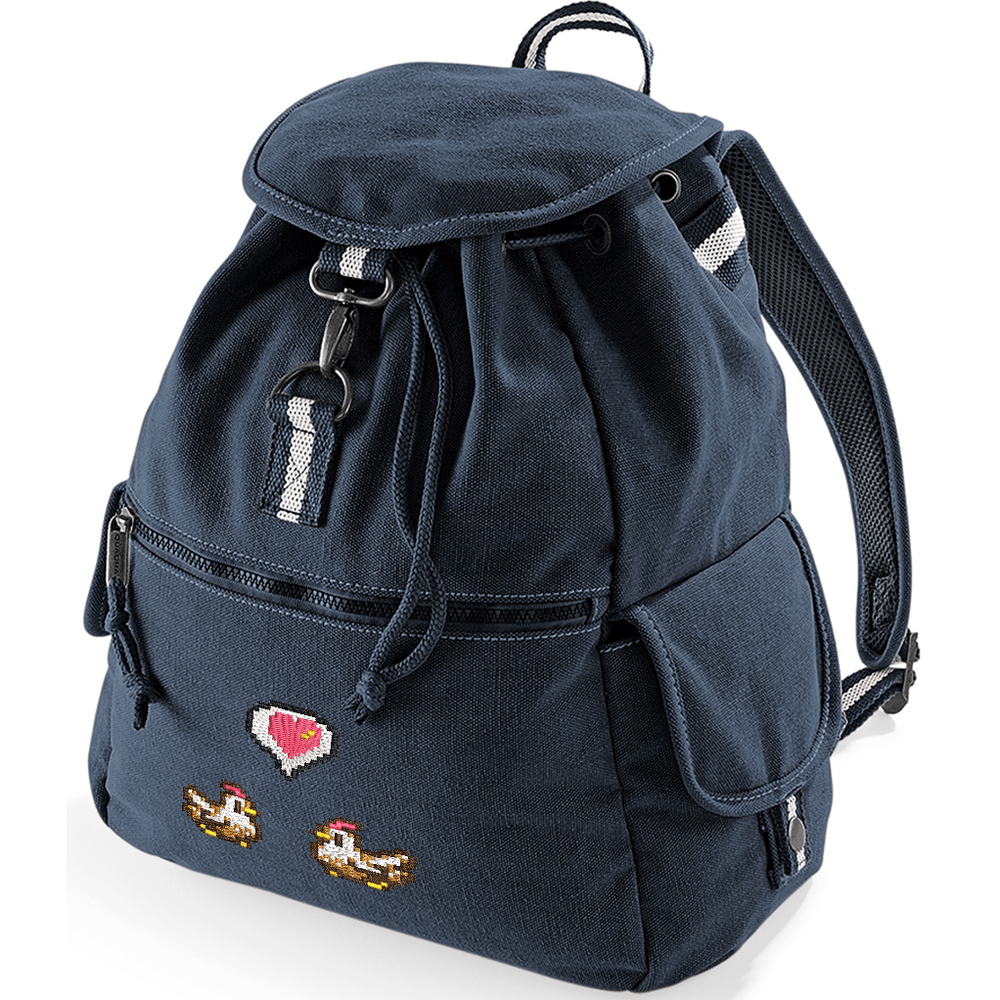 This navy blue canvas backpack features embroidered pixel art of chickens and a heart emote referencing the Stardew Valley video game.