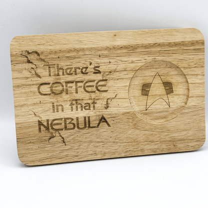 A wooden Voyager breakfast board features laser-engraved text reading "There's Coffee in that Nebula" along with a Starfleet delta shield symbol.