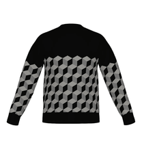 Black sweater with geometric cube pattern on a white background