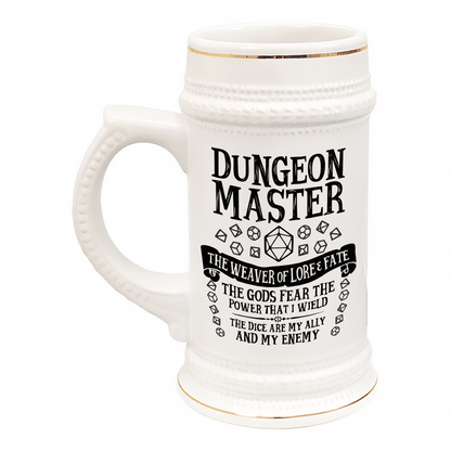 This white ceramic tankard features gold accents and displays "Dungeon Master" along with dice symbols and phrases related to D&D.