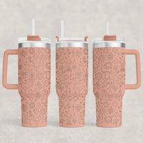 A pink D&D Engraved 40oz Tumbler displays a pattern of RPG Essentials icons including dice and adventure symbols.